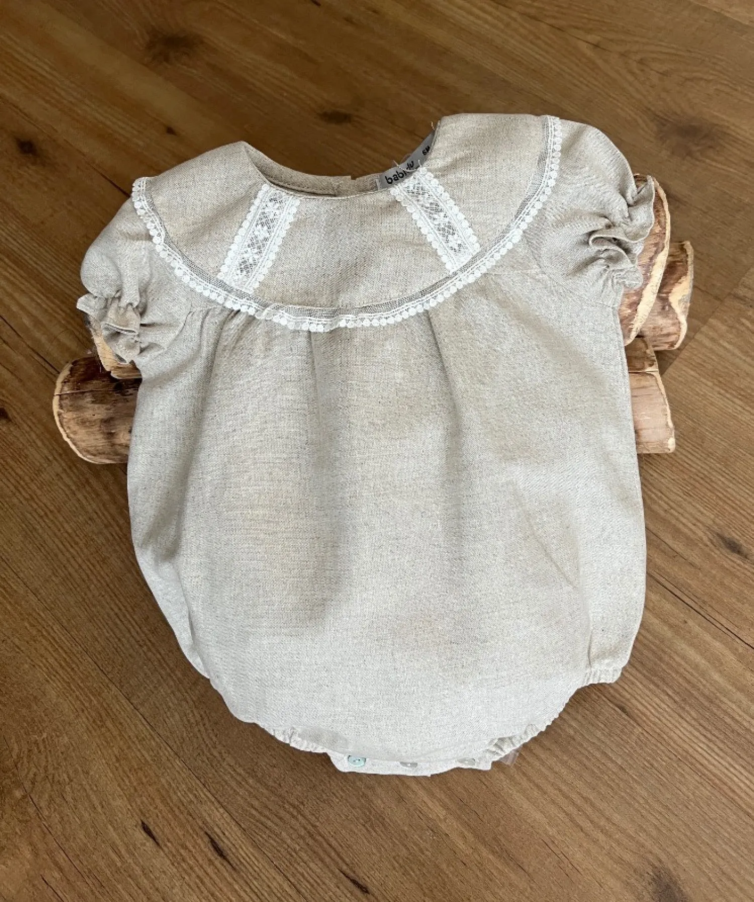 Sand-colored linen unisex romper. Terra Collection