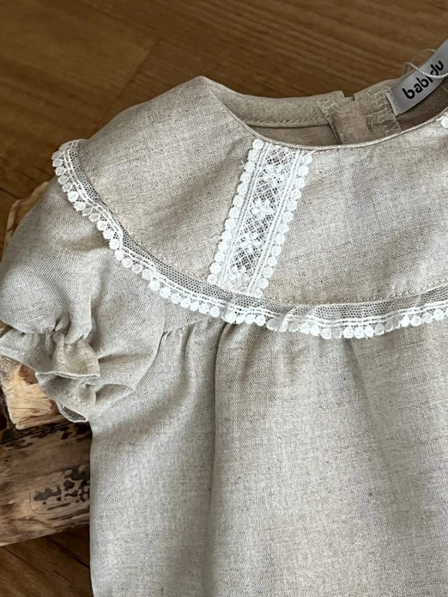 Sand-colored linen unisex romper. Terra Collection